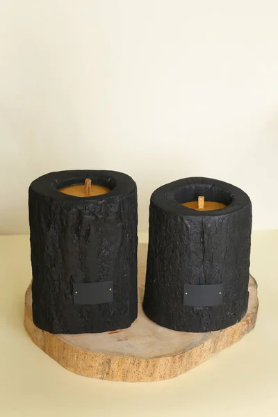 Wooden candle holder rustic interior centerpiece with candles in a cozy barn setting. — Stock Photo, Image