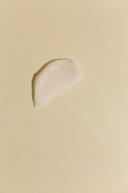 Tarafsız arkaplanda kozmetik krem dokusu