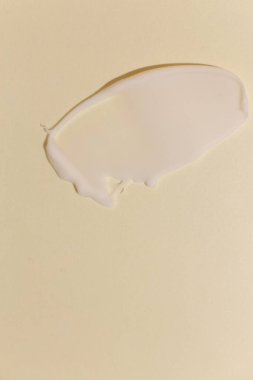 Tarafsız arkaplanda kozmetik krem dokusu