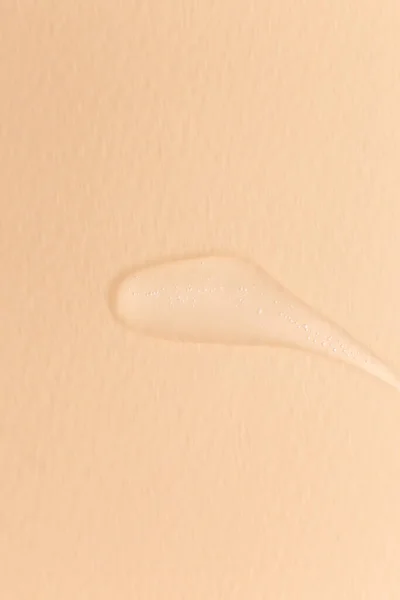 Crema gel transparente textura de la muestra cosmética aislada sobre fondo beige —  Fotos de Stock