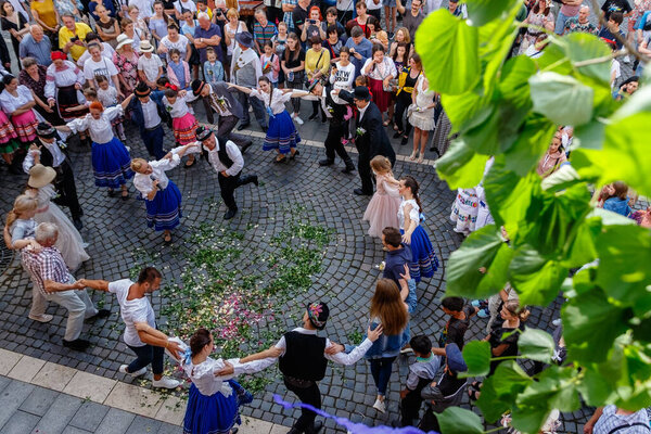 Uzhgorod, Ukraine - June 19, 2021: Artists of the Transcarpathian Folk Choir demonstrate to passers-by the ancient wedding traditions of the townspeople who lived in the eighteenth century.