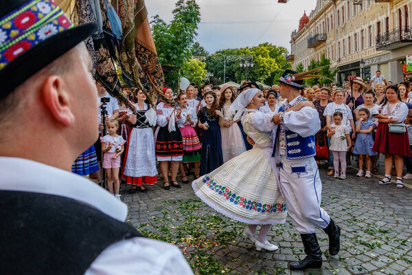 Uzhgorod, Ukraine - June 19, 2021: Artists of the Transcarpathian Folk Choir demonstrate to passers-by the ancient wedding traditions of the townspeople who lived in the eighteenth century.