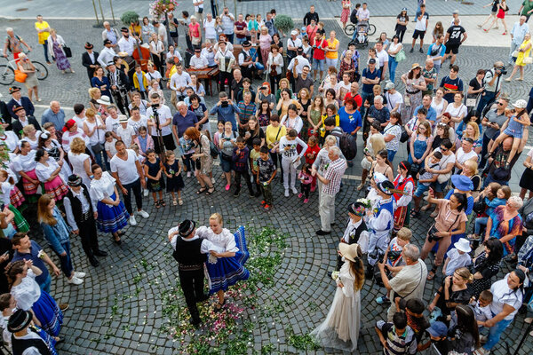 Uzhgorod, Ukraine - June 19, 2021: Artists of the Transcarpathian Folk Choir demonstrate to passers-by the ancient wedding traditions of the townspeople who lived in the eighteenth century.