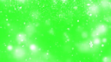 Bokeh parçacıklarının arka planında ışıldayan yeşil ekran kar animasyonu kar tanecikleriyle kaplı kar taneleri fırıl fırıl dönüyor ve yere düşüyor. Kış, Noel, Yılbaşı ve H
