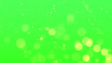 yeşil ekran arkaplanındaki altın parıltılı parçacıkların animasyonu