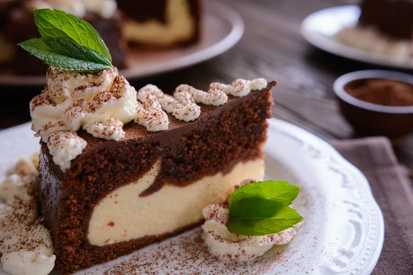 Piece of chocolate cheesecake with whipped cream — Stock Photo, Image