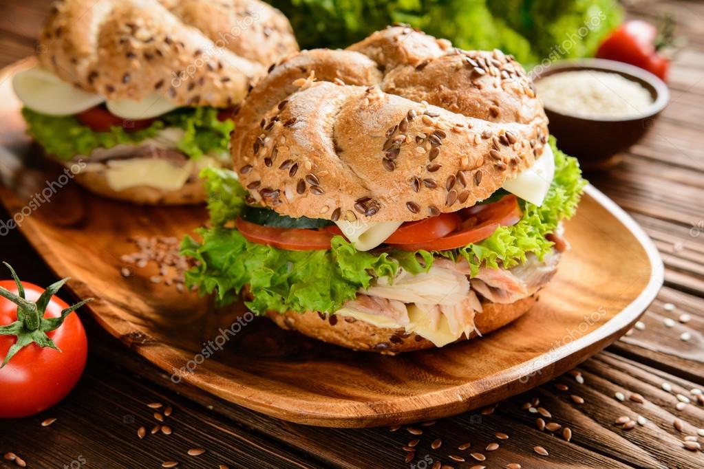 Fish burger with mackerel meat, cheese and fresh vegetable — Stock