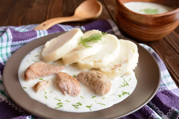 Turkey meat with dill sauce and bread dumpling — Stock Photo, Image
