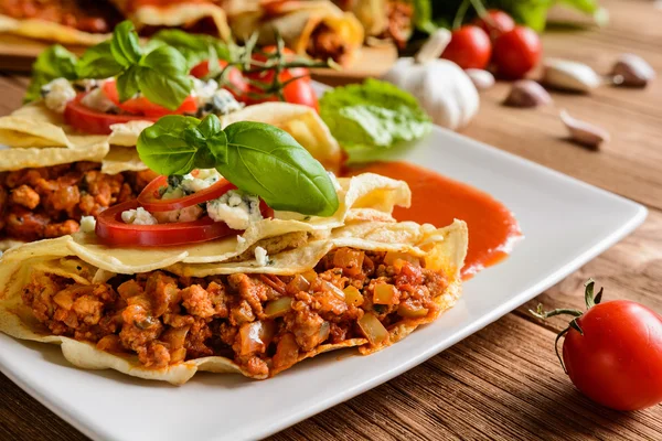 Stuffed Bolognese pancakes with minced meat and vegetable with tomato sauce — Stock Photo, Image