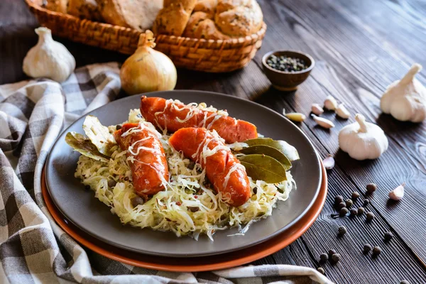 Roasted sausages with steamed cabbage — Stock Photo, Image