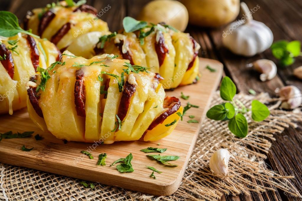 Baked potatoes stuffed with sausage, cheese, garlic and herbs Stock