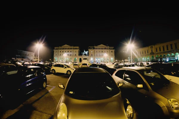 Cars parked on the central square of the city of Novara in Italy. Toning. Soft focus — Stock Photo, Image