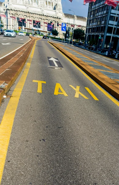 Calling a taxi and detail of written. Special lane for taxis in Milan near the railway station. — Stock Photo, Image