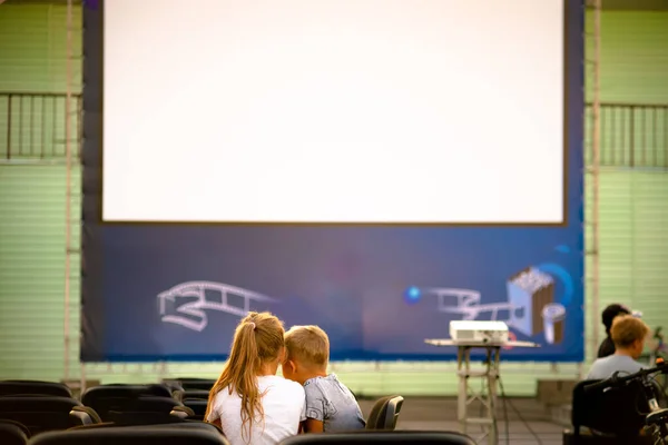 Summer cinema. Children waiting for films to be shown