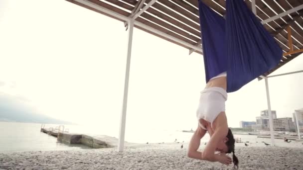 Anti-gravity Yoga, woman doing yoga exercises — Stock Video