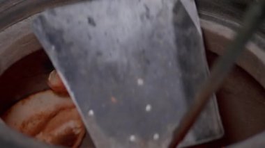 There is preparing process of pitta bread in tandoori