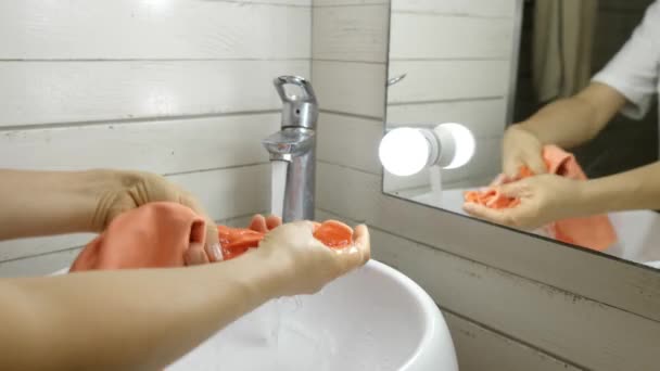 Woman is cleaning the tap in the bathroom, close-up hands — Stock Video