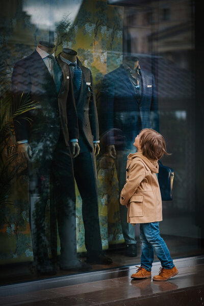 Little boy on a walk in city