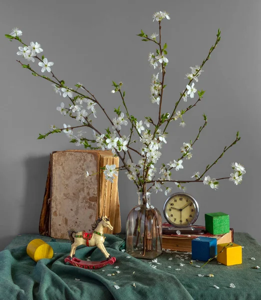 Still Life Wooden Toys Books Bouquet Wild Cherry Blossoms Clock — Stock Photo, Image