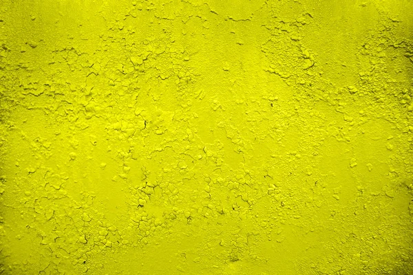 Pęknięta faktura farby. Pęknięta żółta farba, tekstura tła — Zdjęcie stockowe