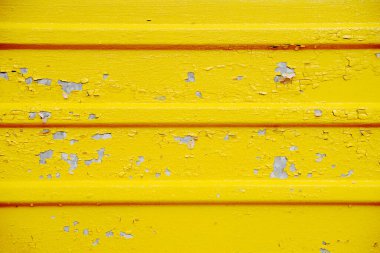 Çatlak boya dokusu detayı. Kırık sarı boya, arka plan dokusu.