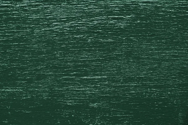 Grön bakgrund. Grön konsistens. sprucken färg struktur. trä bakgrund — Stockfoto