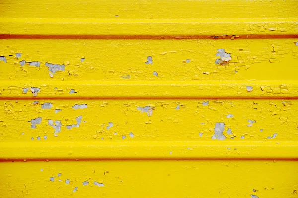 Detalhe de textura de tinta rachada. Rachado descamação tinta amarela, textura de fundo — Fotografia de Stock