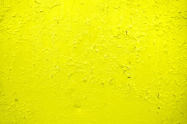 Gekraakte verf achtergrond. Muurachtergrond. Close-up detail van gescheurde verf op gele en grijze wand — Stockfoto