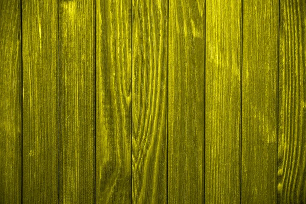 Gros plan vieille clôture en bois jaune avec espace de copie. Un mur de planches de bois effilochées. Texture de vieilles planches peintes. Texture de vieilles planches de bois avec peinture pelante. Contexte et texture pour le design — Photo