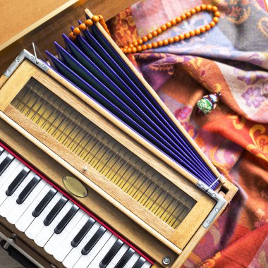Indian harmonium, a traditional wooden keyboard instrument, close-up clipart