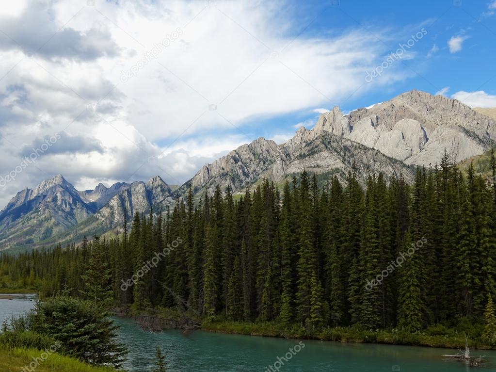 Canadian Landscape with Turquoise River and Rocky Mountains