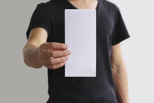 Man showing blank white flyer brochure booklet. Leaflet presentation. Pamphlet hold hands. Man show clear offset paper. Sheet template. Booklet design sheet display read first person. — Stock Photo, Image