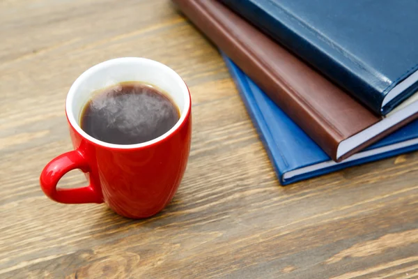 Taza de café y bloc de notas — Foto de Stock