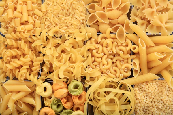 Full background of raw pasta — Stock Photo, Image