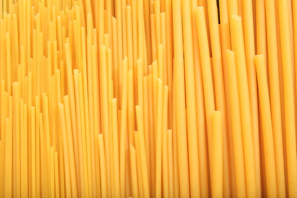 Full background of raw spaghetti pasta — Stock Photo, Image