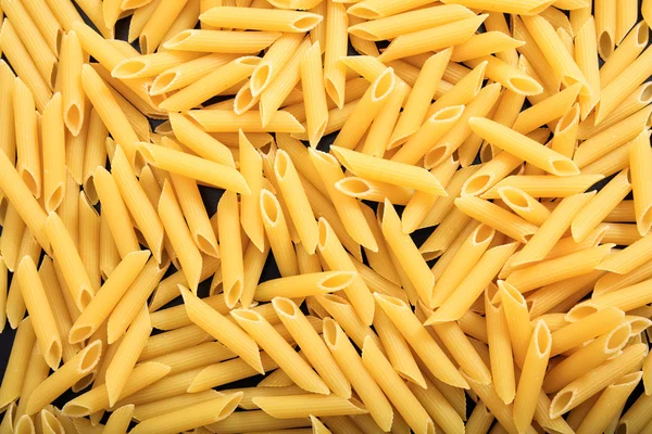 Fondo completo de pasta de penne cruda —  Fotos de Stock