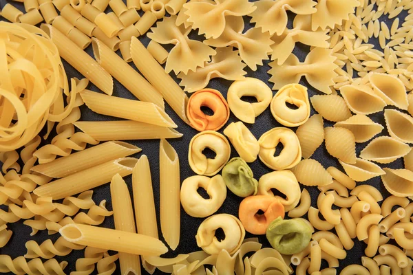 Full background of raw pasta — Stock Photo, Image
