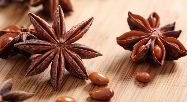 Star anises on a wooden surface — Stock Photo, Image