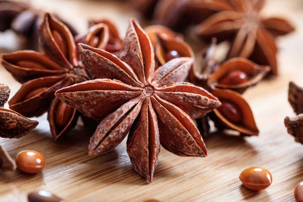 Star anises on a wooden surface — Stock Photo, Image