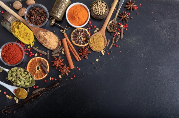 Composition of spices on a black background — Stock Photo, Image