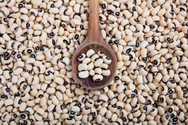 Wooden spoon and black eyed peas background clipart