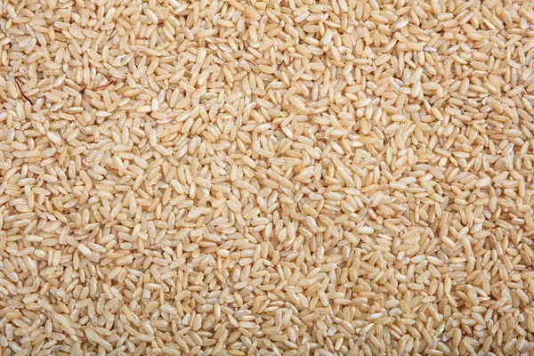 Fundo de arroz não refinado marrom — Fotografia de Stock