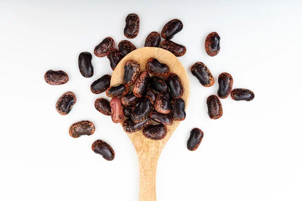 Raw lima beans in a wooden spoon — Stock Photo, Image