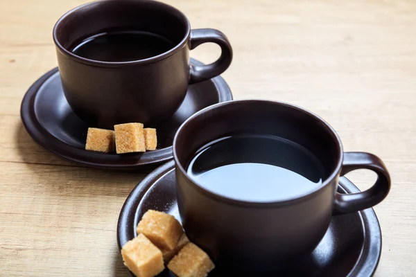 Cups of coffee on a wooden table — Stock Photo, Image