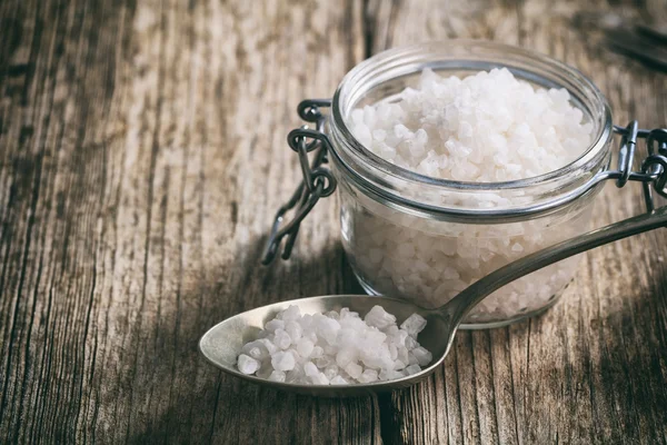 White salt on a wooden surface — Stock Photo, Image