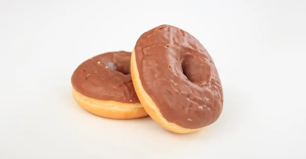 Chocolate donuts on white background — Stock Photo, Image