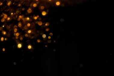 Pırıl pırıl ışıklar arka plan. Altın ve siyah. & Odaklan
