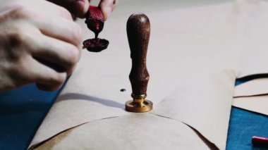 Vintage notary stamp with the wax seal, footage of a man sealing a letter