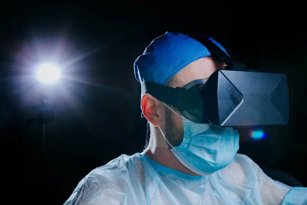 male doctor in a virtual reality helmet, modern technologies in medicine.