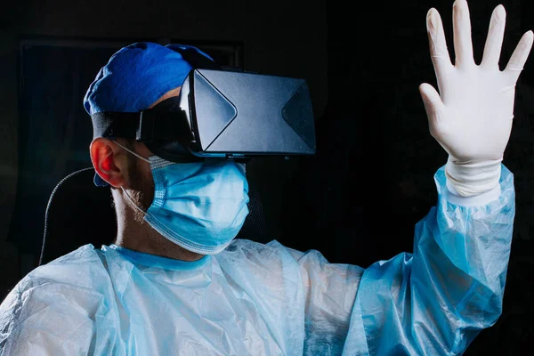 male doctor in a virtual reality helmet, modern technologies in medicine.